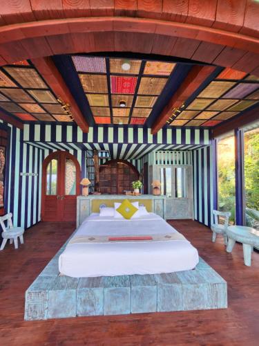 a bedroom with a large bed in a room at Sapa Clay House - Mountain Retreat in Sa Pa
