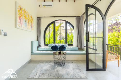 a room with a window seat in a house at Kahuna Villas by Bukit Vista in Sanur