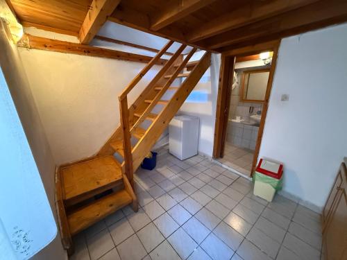 an overhead view of a bathroom with a staircase in a house at Xinovrissi Studios in Xinóvrisi
