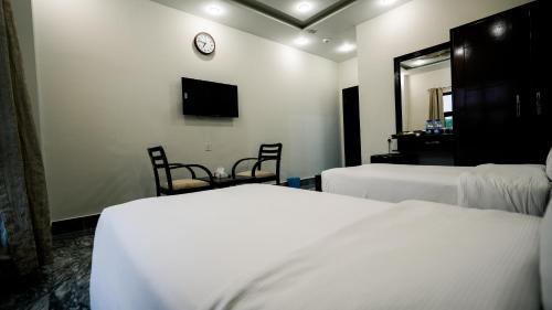 Postel nebo postele na pokoji v ubytování Hotel Nova