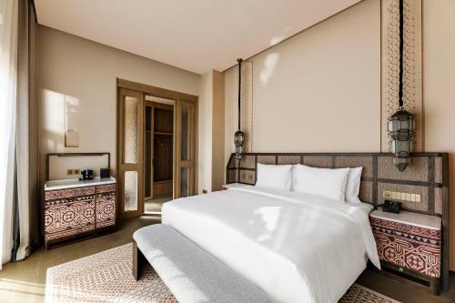 Postel nebo postele na pokoji v ubytování Wanda Ganman Dunhuang