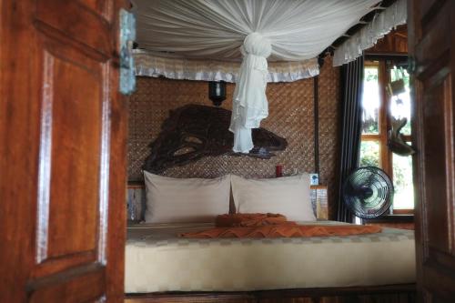 En eller flere senge i et værelse på Phi Phi Relax Beach Resort