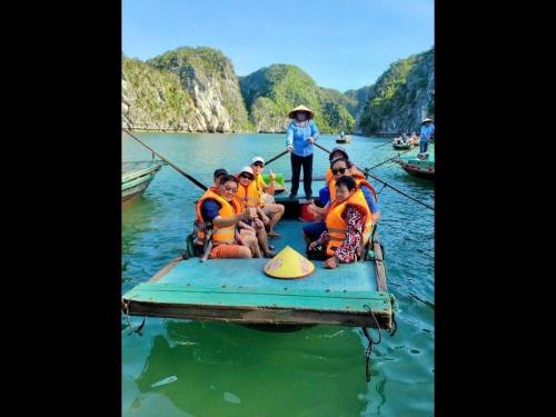 a group of people in a raft in the water at Venus Cruises Halong Bay in Ha Long