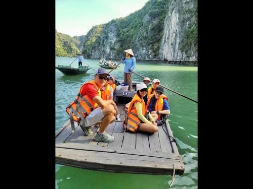 a group of people on a raft in the water at Venus Cruises Halong Bay in Ha Long