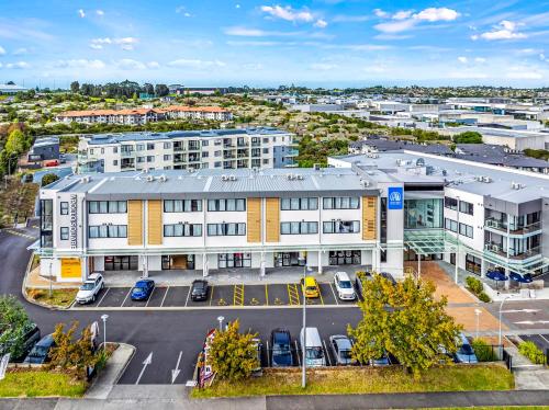 an aerial view of a building with a parking lot at Marsden Suites Albany in Albany