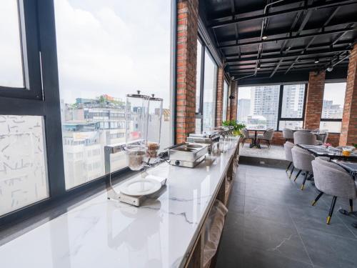 a room with a counter and some windows at San Hanoi Hotel & Gaming in Hanoi
