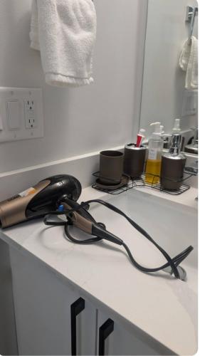 a kitchen counter with a phone on top of it at Cozy Escape Guest Suite in Edmonton