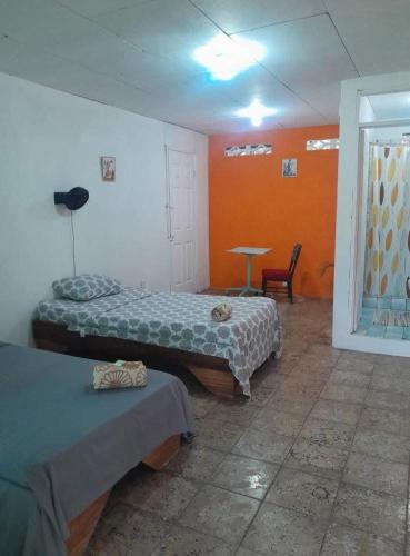 Cama o camas de una habitación en Roomsmagicoco