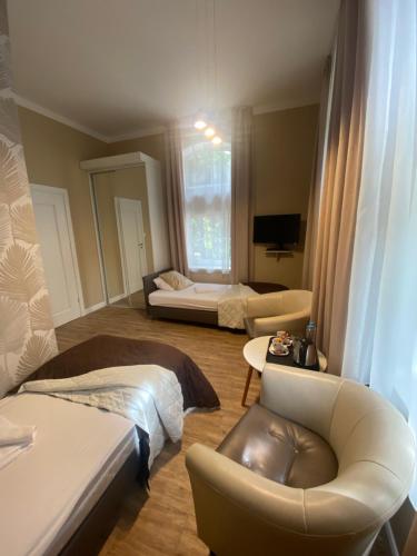 Postel nebo postele na pokoji v ubytování Hotel Kamil