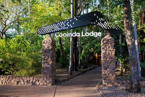 a sign for the columbola lodge in a park at Cooinda Lodge Kakadu in Jabiru
