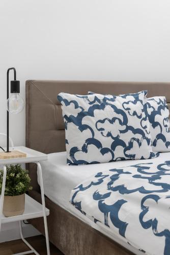 Ein Bett oder Betten in einem Zimmer der Unterkunft HideOut Apartments