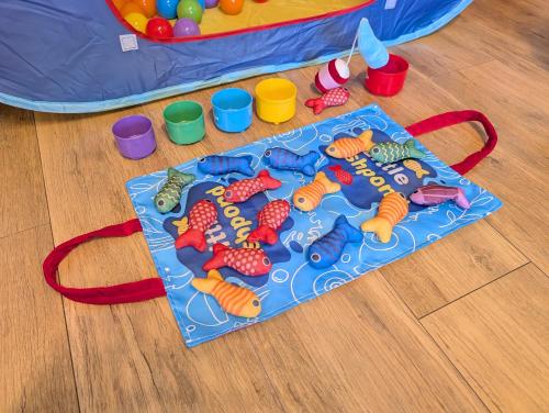 a play mat with carrots and toys on the floor at Nagoya Station is 17 minutes by car parking for 2 cars! Up to 11 people pets welcome! in Kiyosu