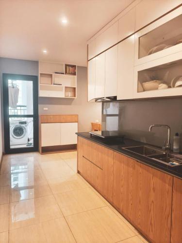 a kitchen with a sink and a counter top at Homestay Hạ Long NewLife in Kon Rung (1)