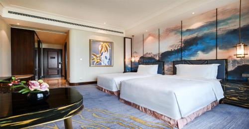 Qingdao Star River Hotelにあるベッド