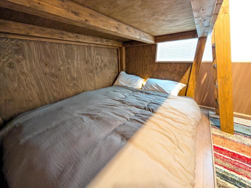 a bed in the inside of a tiny house at 17minutes by car to Nagoya-Sta 1parking in Chiharachō