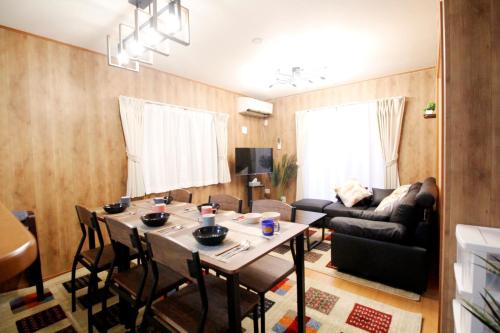 a living room with a table and a couch at 22minutes by car to Nagoya Station 2parking 