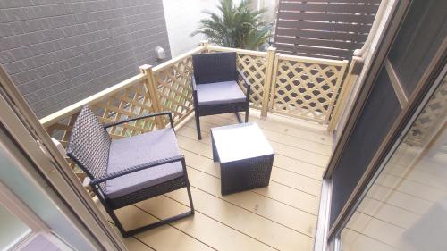 two chairs and a table on a balcony at 22minutes by car to Nagoya Station 2parking 