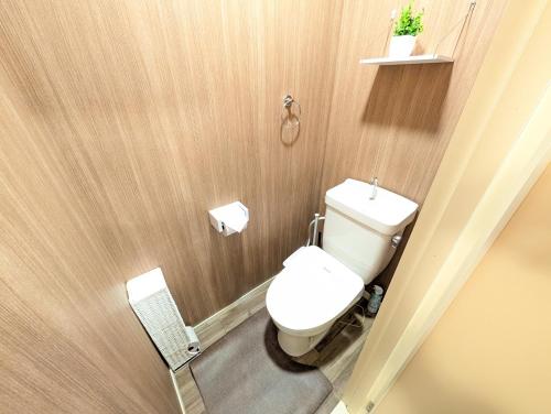 a bathroom with a white toilet in a room at 17minutes by car to Nagoya-Sta 1parking in Chiharachō