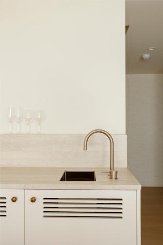 a kitchen with a sink and a counter top at Marina Resort in Nelson Bay