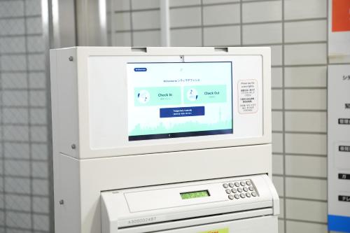 a microwave oven with a screen on top of it at シティラデファンス - 2025年6月室内リニューアル in Sapporo