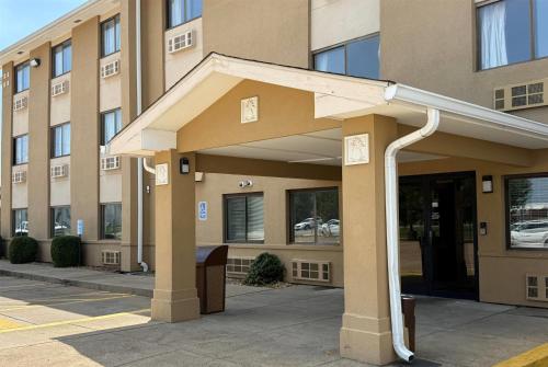 a building with an awning in front of it at Super 8 by Wyndham Evansville East in Evansville