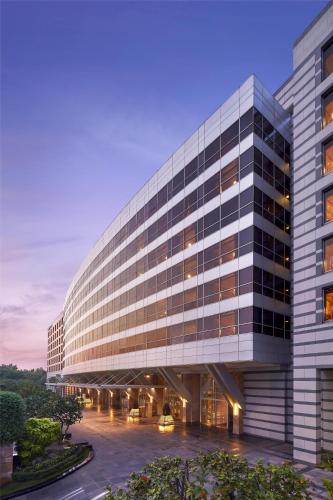 an office building with a large building at Grand Hyatt Mumbai Hotel and Residences in Mumbai