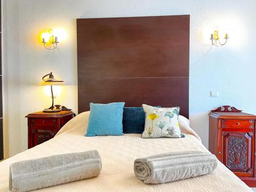 a bedroom with a large bed with two night stands at Stunning Casa Nicole by Be Cherish in Pêra