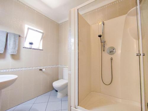 a bathroom with a shower and a toilet and a sink at Stunning Casa Nicole by Be Cherish in Pêra
