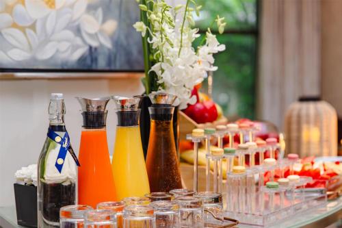 a table with many bottles of drinks on it at Kempinski The One Suites Hotel Shanghai Downtown in Shanghai