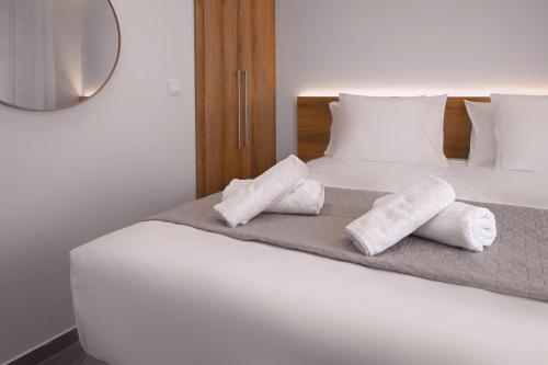 Una cama o camas en una habitación de Aria Blu