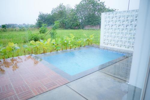 Kolam renang di atau dekat dengan Putih Kaca Villa