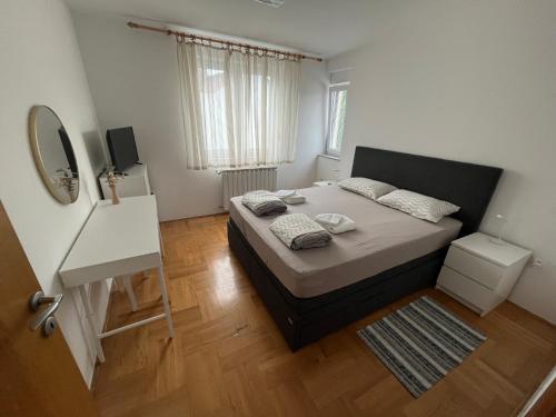 Ένα ή περισσότερα κρεβάτια σε δωμάτιο στο Apartman KOD MLINA