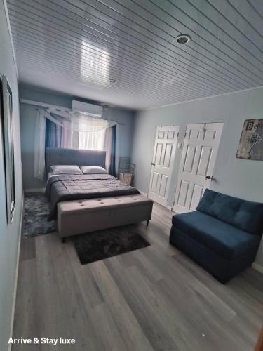 Ένα ή περισσότερα κρεβάτια σε δωμάτιο στο Arrive and Stay Luxe