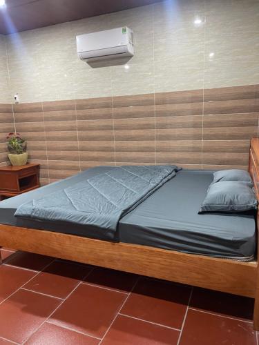 Postel nebo postele na pokoji v ubytování Homestay Sỏi Đá - Tây Ninh