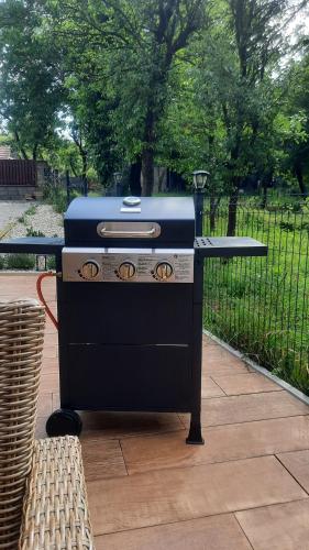 a grill sitting under a table in a park at Penzion a drevenica pri Hati in Terchová