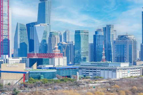 a view of a city with tall buildings at Hotel Aventree Yeouido in Seoul