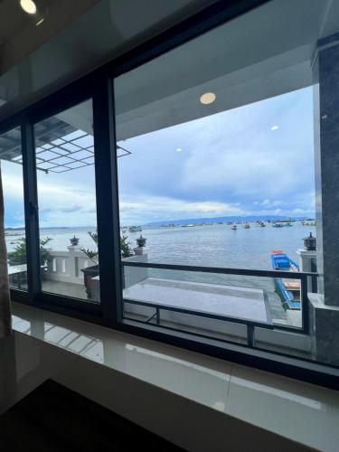 a window with a view of the water at Happy House Gành Dầu in Phu Quoc