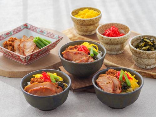 a group of bowls of food on a table at Manza Prince Hotel in Tsumagoi