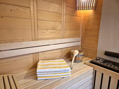 a sauna with a towel sitting on a bench at Ferienwohnung Simonhof in Maria Alm am Steinernen Meer