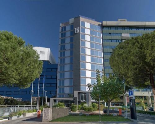 a tall building with a lot of windows at Hi Hotel Bari in Bari