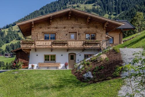 a wooden house on top of a hill at Waltenberghof in Kitzbühel