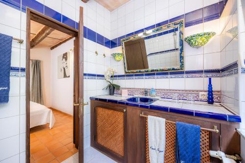 a bathroom with a sink and a mirror at Individual Guesthouse Mallorca in Son Macia
