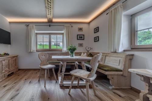 a dining room with a table and chairs at Waltenberghof in Kitzbühel