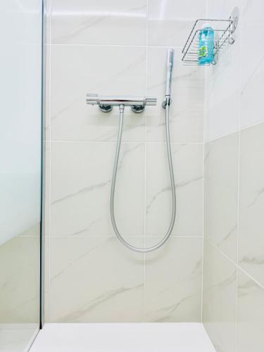 a shower with a glass door in a bathroom at Princess Palace Monte-Carlo in Monte Carlo