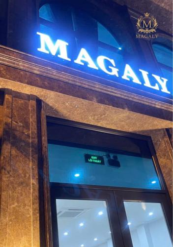 a nissan sign on the side of a building at Magaly Apartment & Hotel in Hai Phong