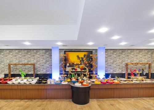 a store filled with lots of shoes on display at Senza Sunset Beach Hotel in Alanya
