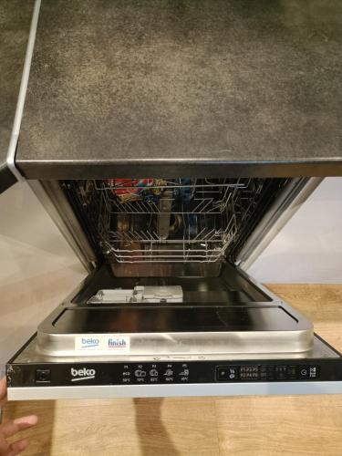 a oven with a rack of dishes in it at Apartament Maria in Oświęcim