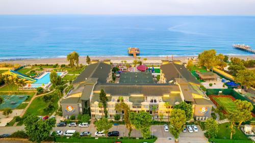 an aerial view of a resort with the beach at Senza Sunset Beach Hotel in Alanya