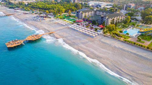 an aerial view of a beach with a pier at Senza Sunset Beach Hotel in Alanya