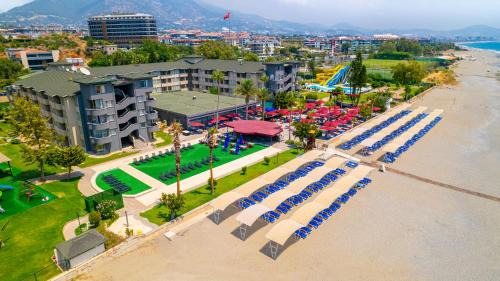 an overhead view of a beach with chairs and a resort at Senza Sunset Beach Hotel in Alanya